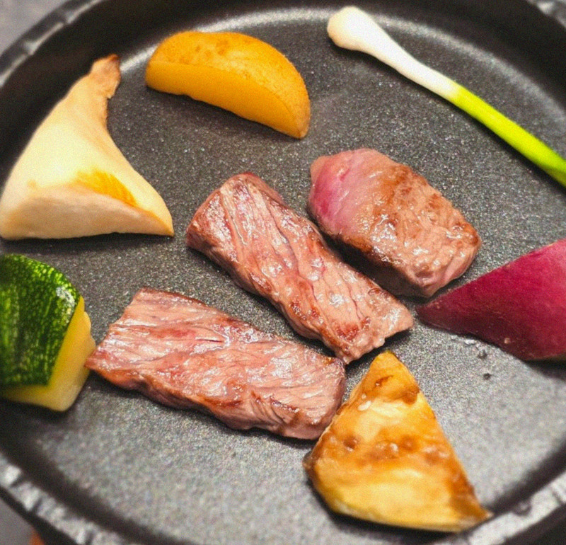 WOOHANA Jonggak · the signature Hanwoo showing — marbled beef cuts and caviar presented in a display chest