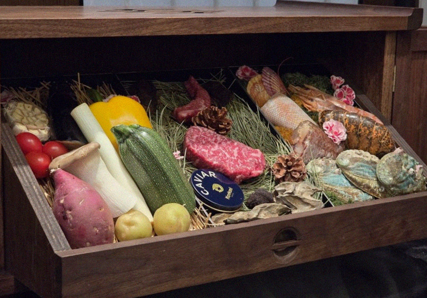 WOOHANA Jonggak · the signature Hanwoo showing — marbled beef cuts and caviar presented in a display chest