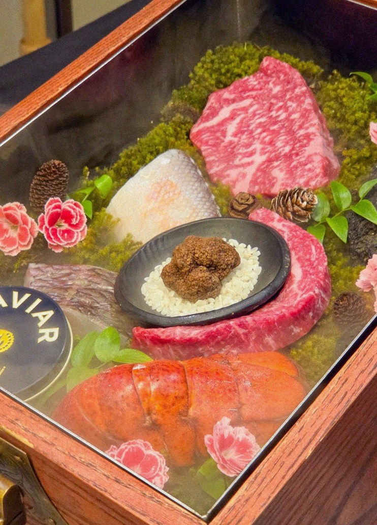 GOWOOGA Yeouido · the signature Hanwoo showing — marbled beef cuts and caviar presented in a display chest
