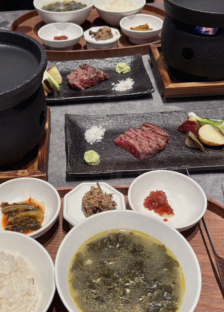 WOOHANA Jonggak · the signature Hanwoo showing — marbled beef cuts and caviar presented in a display chest