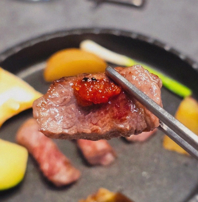 WOOHANA Jonggak · the signature Hanwoo showing — marbled beef cuts and caviar presented in a display chest