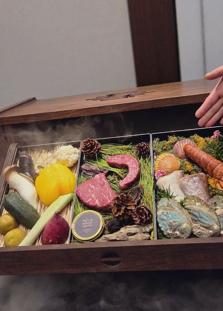 WOOHANA Jonggak · the signature Hanwoo showing — marbled beef cuts and caviar presented in a display chest