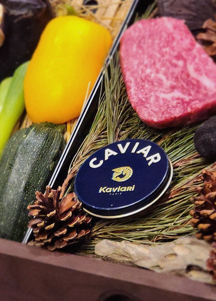 WOOHANA Jonggak · the signature Hanwoo showing — marbled beef cuts and caviar presented in a display chest