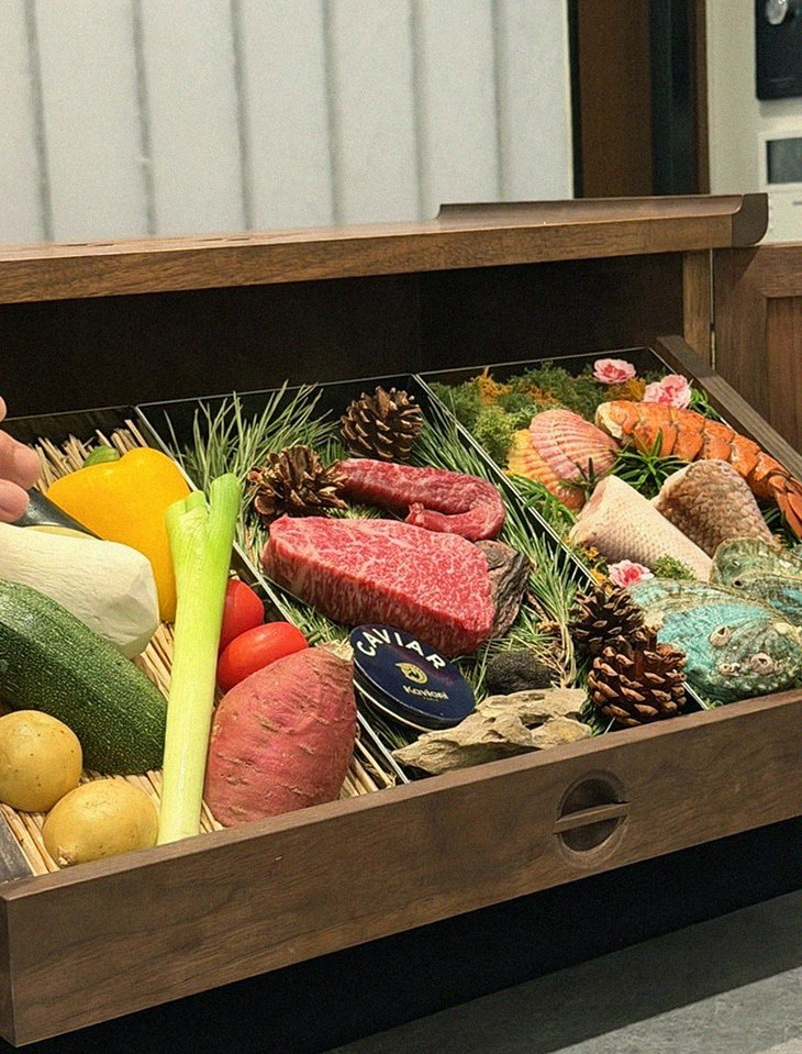 WOOHANA Jonggak · the signature Hanwoo showing — marbled beef cuts and caviar presented in a display chest