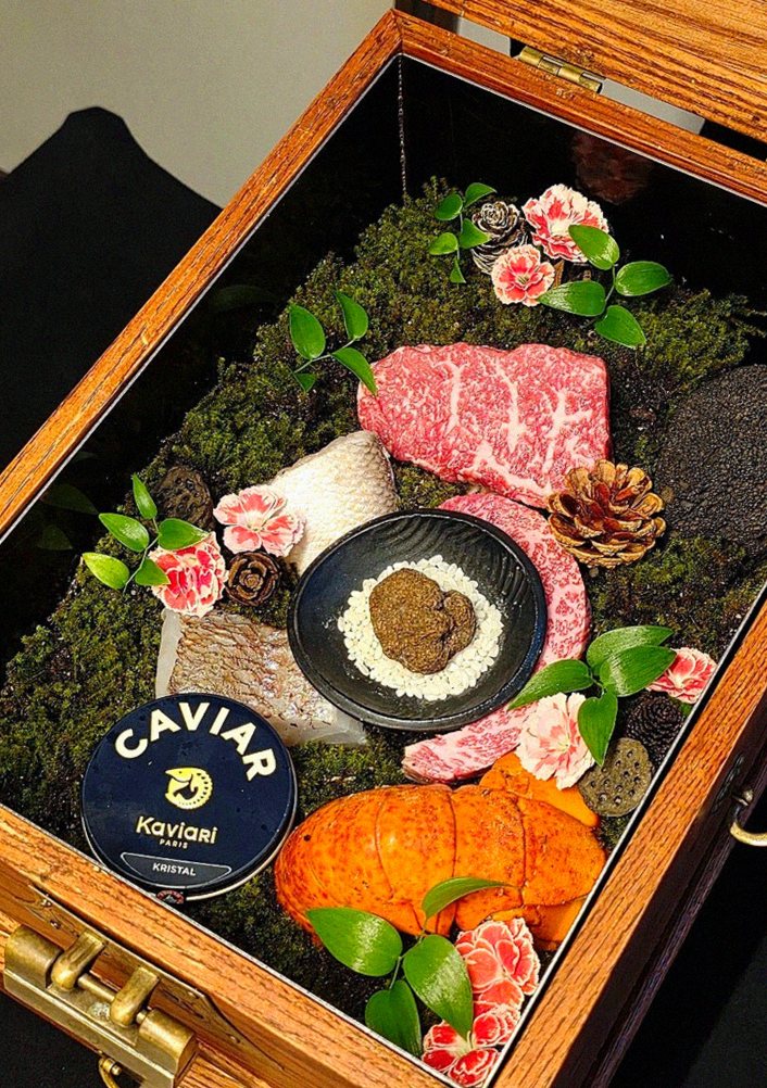 GOWOOGA Yeouido · the signature Hanwoo showing — marbled beef cuts and caviar presented in a display chest