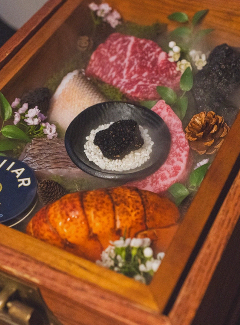 GOWOOGA Yeouido · the signature Hanwoo showing — marbled beef cuts and caviar presented in a display chest