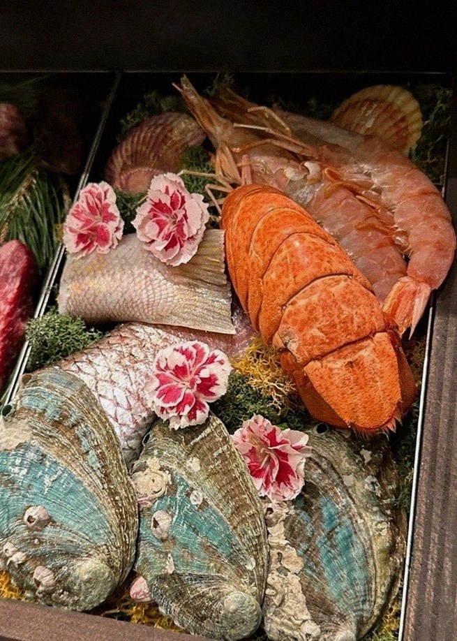 WOOHANA Jonggak · seafood course served alongside the beef