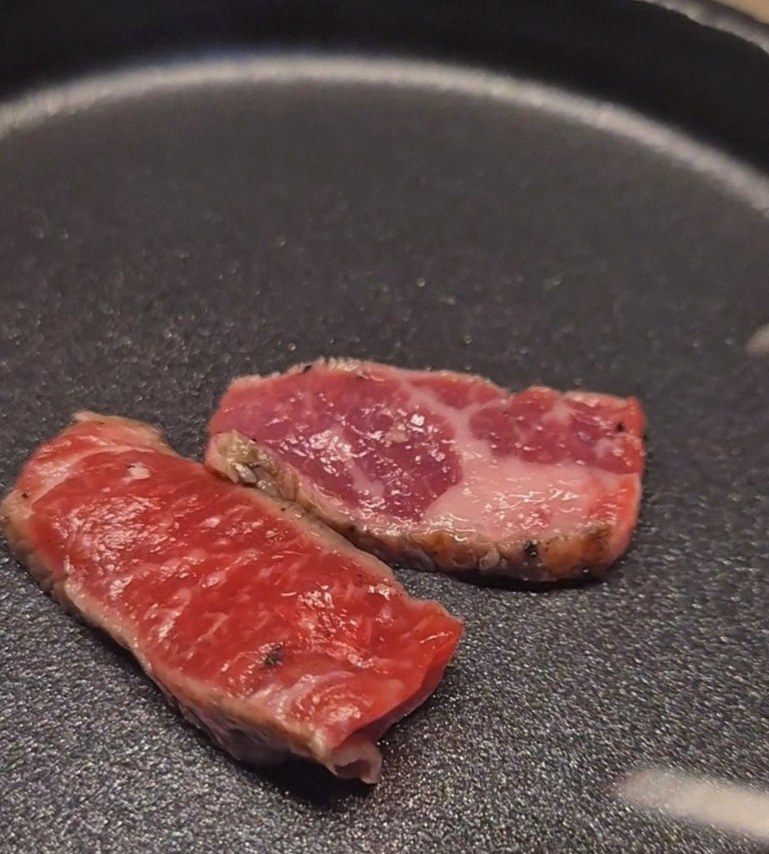 WOOARA Gwanghwamun · premium marbled Hanwoo beef presented before grilling