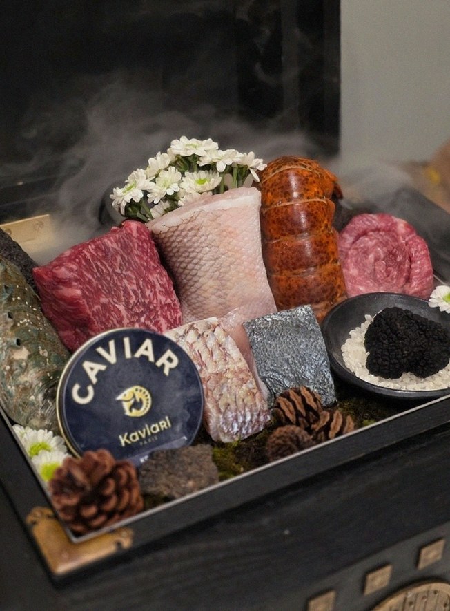 GOWOOGA Gwanghwamun · the signature Hanwoo showing — marbled beef cuts and caviar presented in a display chest