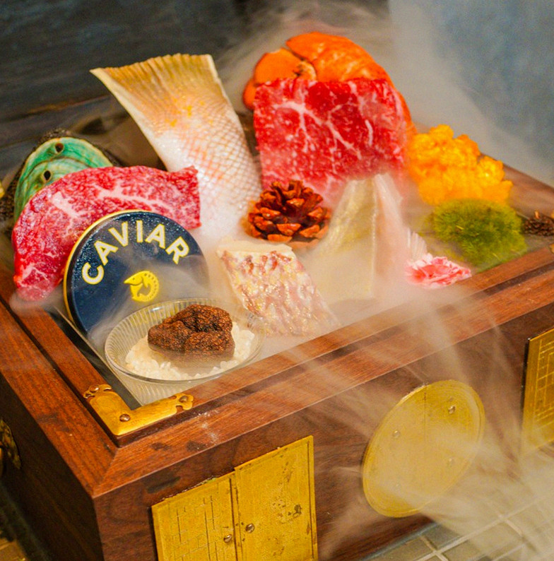 GOWOOGA Gangnam·Yeoksam · the signature Hanwoo showing — marbled beef cuts and caviar presented in a display chest