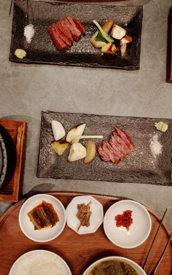 WOOHANA Yeouido · the signature Hanwoo showing — marbled beef cuts and caviar presented in a display chest