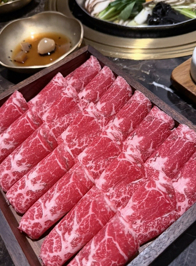 DAEBOJUNG City Hall · premium marbled Hanwoo beef presented before grilling