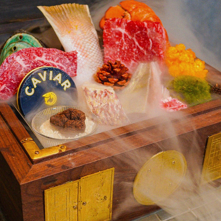 GOWOOGA Gangnam·Yeoksam · the signature Hanwoo showing — marbled beef cuts and caviar presented in a display chest