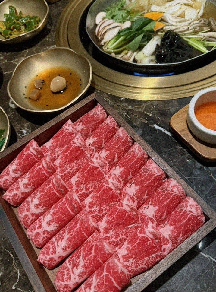 DAEBOJUNG City Hall · the signature Hanwoo showing — marbled beef cuts and caviar presented in a display chest