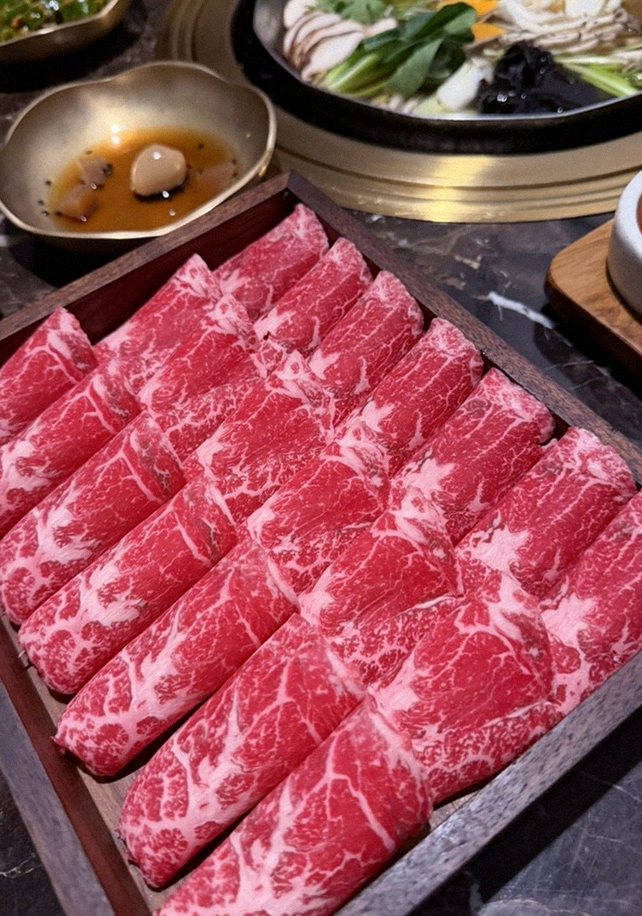 DAEBOJUNG City Hall · premium marbled Hanwoo beef presented before grilling
