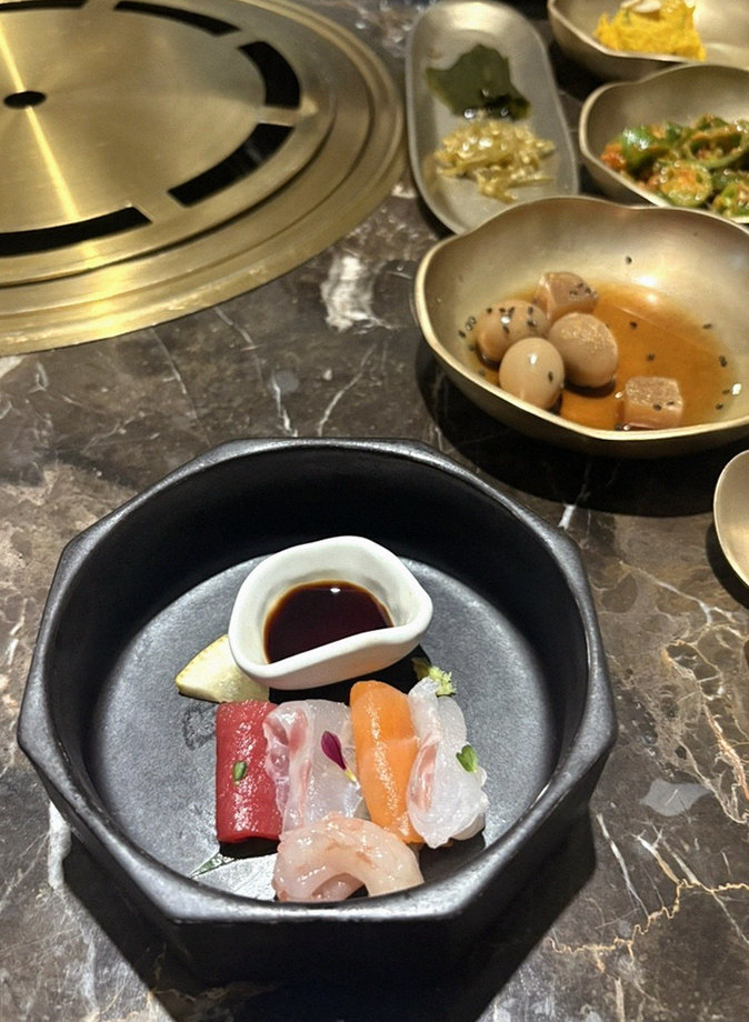 DAEBOJUNG City Hall · the signature Hanwoo showing — marbled beef cuts and caviar presented in a display chest