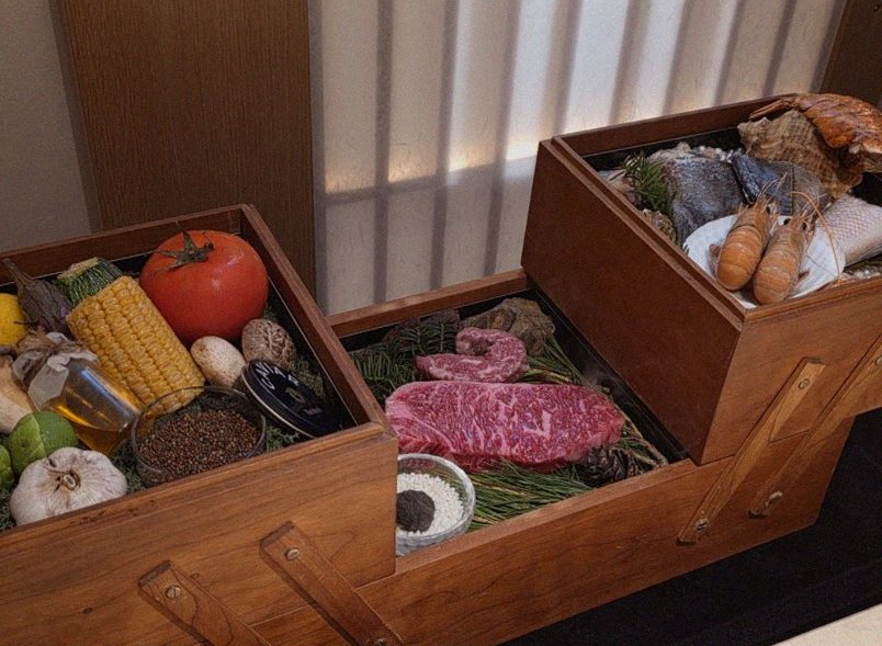 WOOARA Gwanghwamun · the signature Hanwoo showing — marbled beef cuts and caviar presented in a display chest