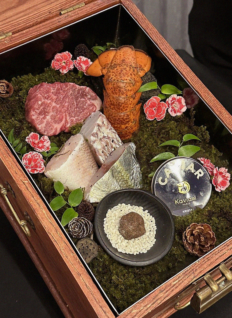 GOWOOGA Yeouido · the signature Hanwoo showing — marbled beef cuts and caviar presented in a display chest