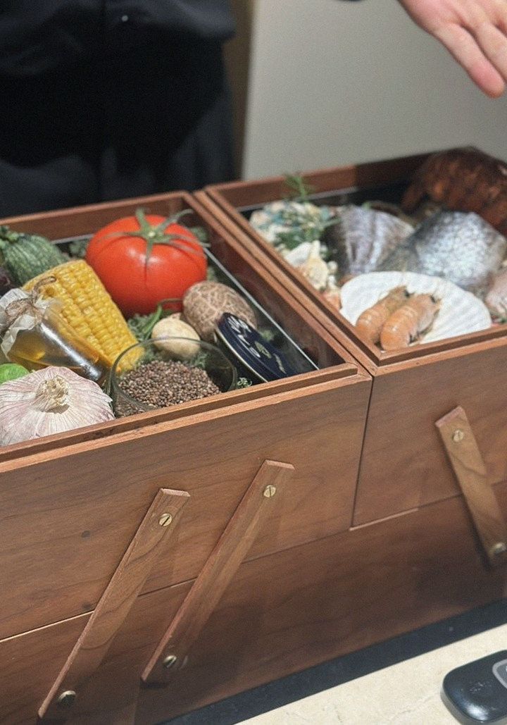 WOOARA Yeouido · the signature Hanwoo showing — marbled beef cuts and caviar presented in a display chest