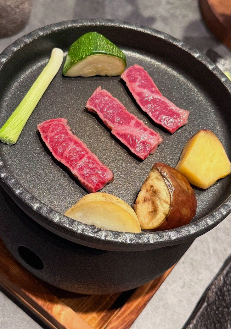 WOOHANA Yeouido · the signature Hanwoo showing — marbled beef cuts and caviar presented in a display chest