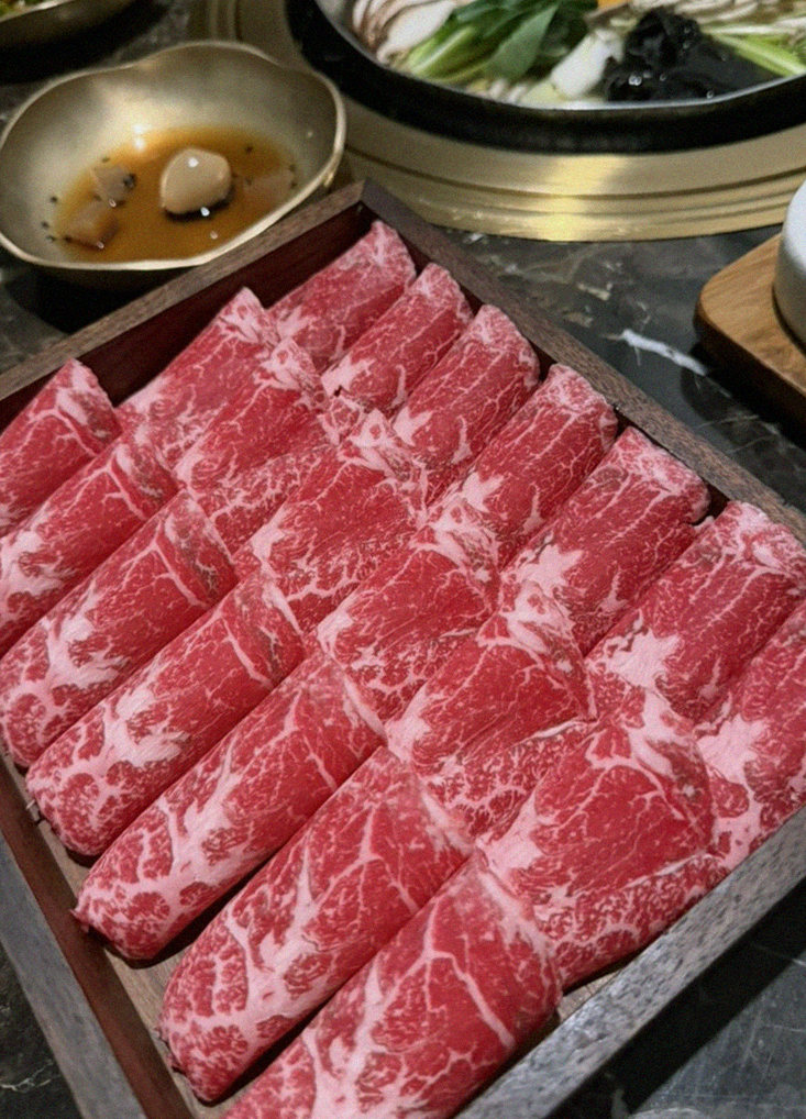 DAEBOJUNG City Hall · premium marbled Hanwoo beef presented before grilling