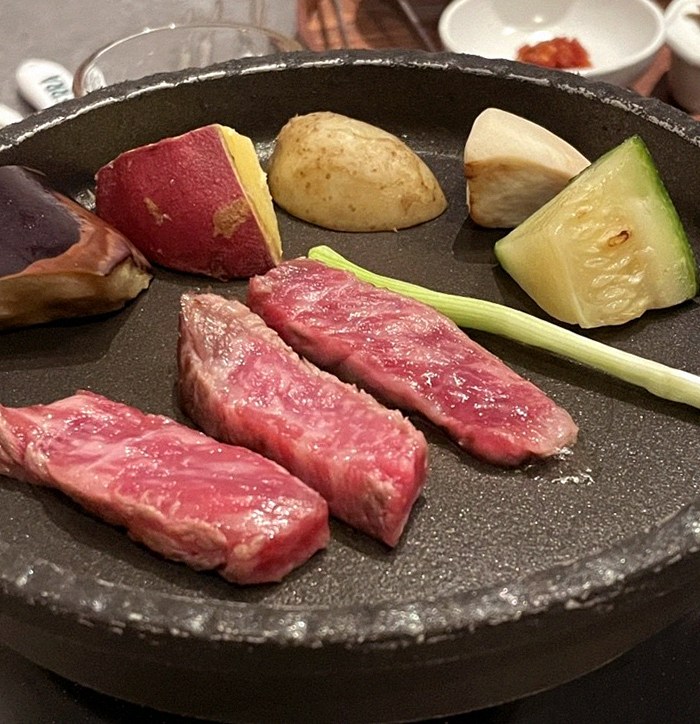 WOOHANA Jonggak · Hanwoo beef grilling over binchotan charcoal