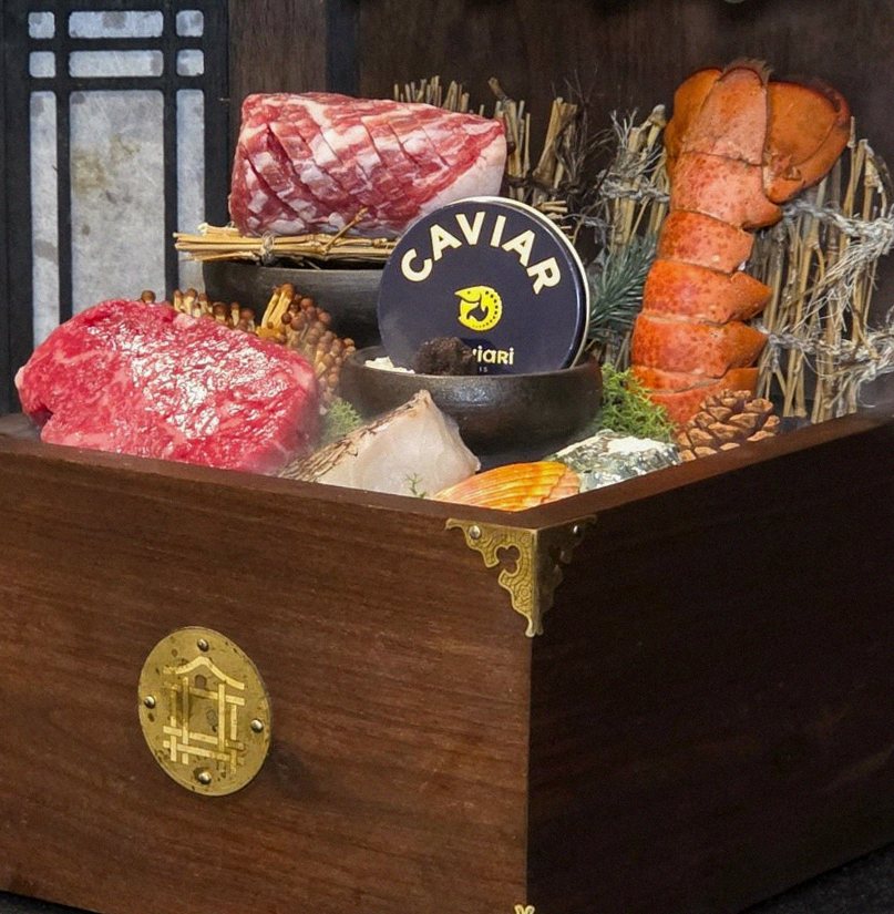 DAEBOJUNG City Hall · the signature Hanwoo showing — marbled beef cuts and caviar presented in a display chest
