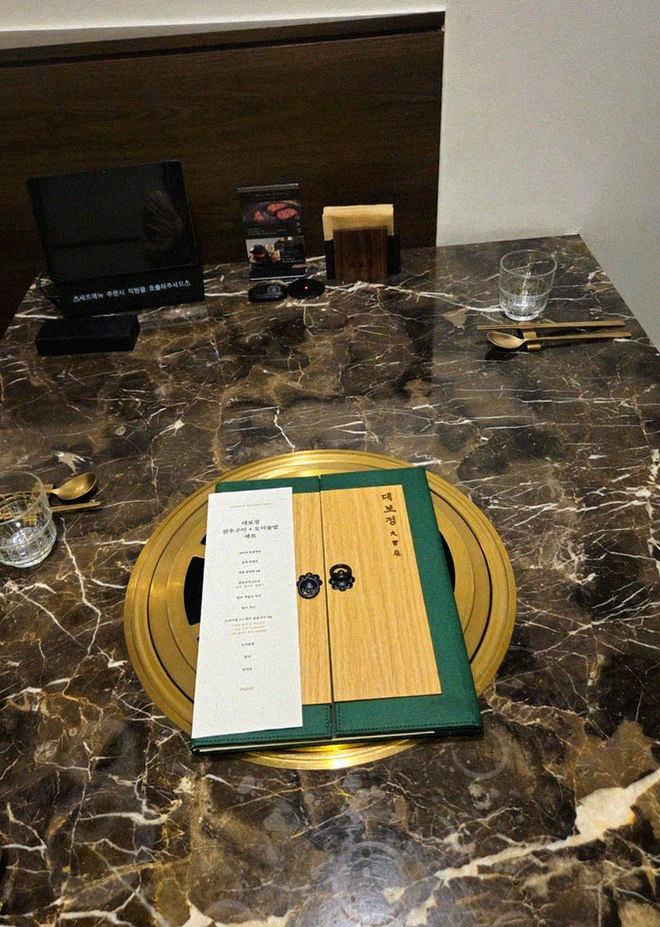 DAEBOJUNG City Hall · the signature Hanwoo showing — marbled beef cuts and caviar presented in a display chest
