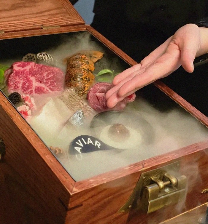 GOWOOGA Yeouido · the signature Hanwoo showing — marbled beef cuts and caviar presented in a display chest