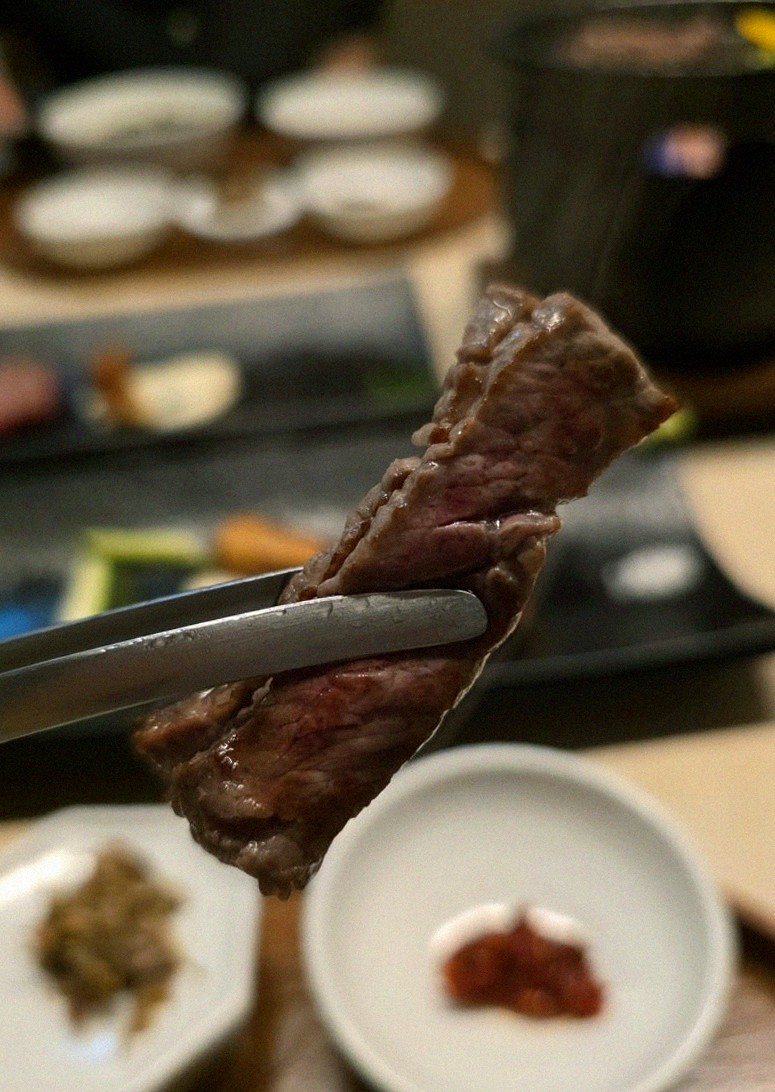 WOOARA Yeouido · premium marbled Hanwoo beef presented before grilling