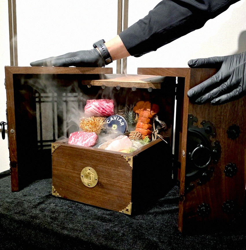 DAEBOJUNG Yeouido · the signature Hanwoo showing — marbled beef cuts and caviar presented in a display chest