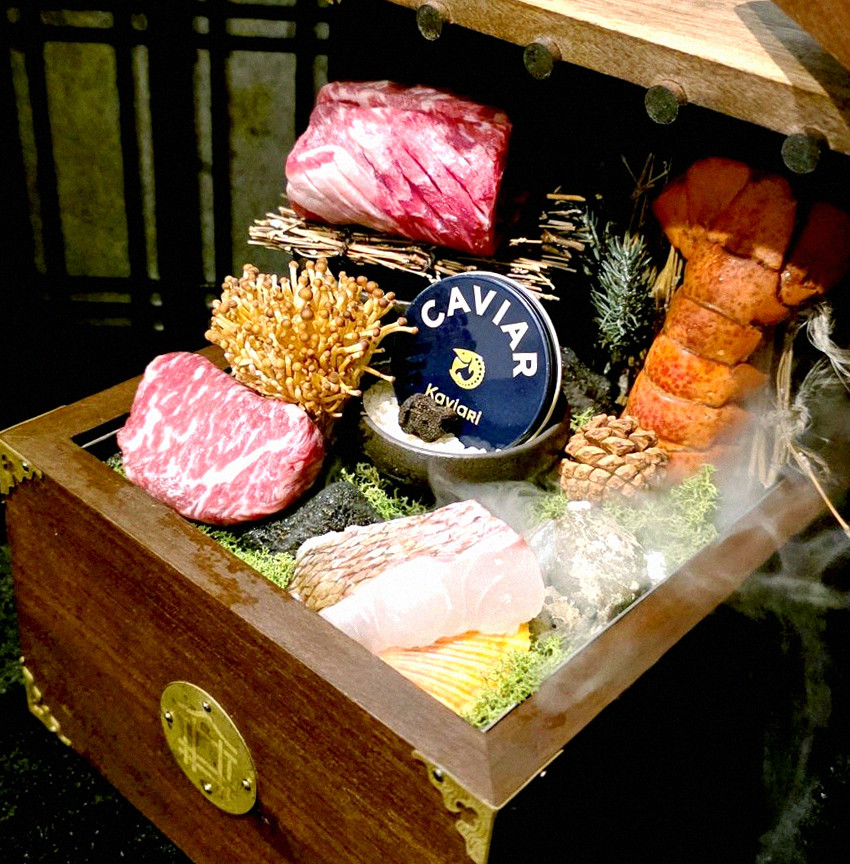 DAEBOJUNG Yeouido · the signature Hanwoo showing — marbled beef cuts and caviar presented in a display chest