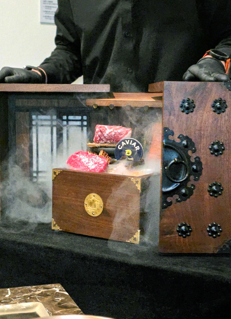 DAEBOJUNG Yeouido · the signature Hanwoo showing — marbled beef cuts and caviar presented in a display chest