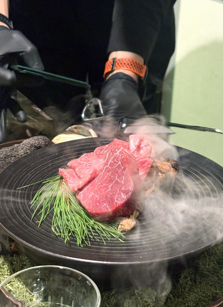 DAEBOJUNG Yeouido · the signature Hanwoo showing — marbled beef cuts and caviar presented in a display chest