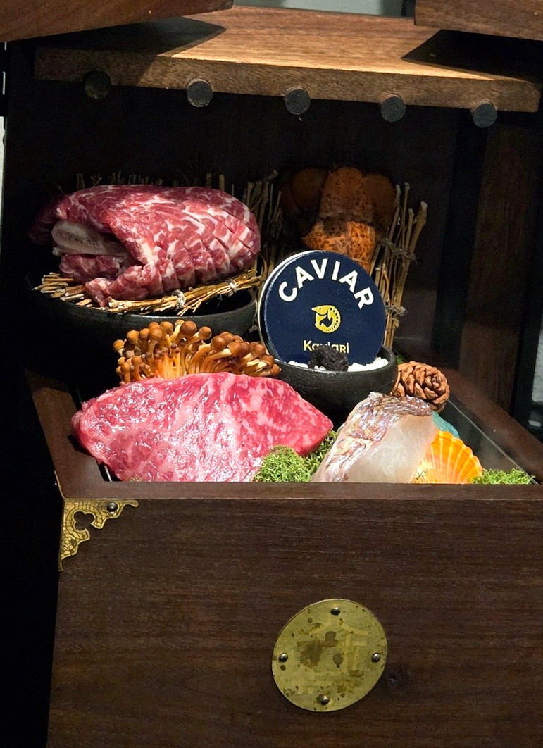 DAEBOJUNG Yeouido · the signature Hanwoo showing — marbled beef cuts and caviar presented in a display chest