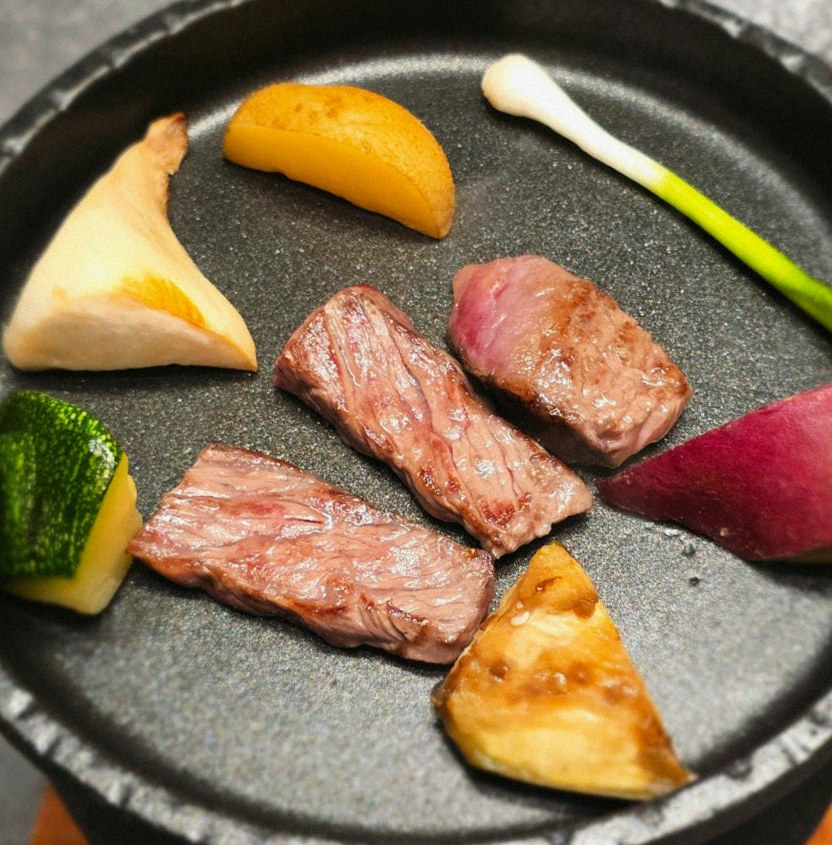 WOOHANA Yeouido · the signature Hanwoo showing — marbled beef cuts and caviar presented in a display chest