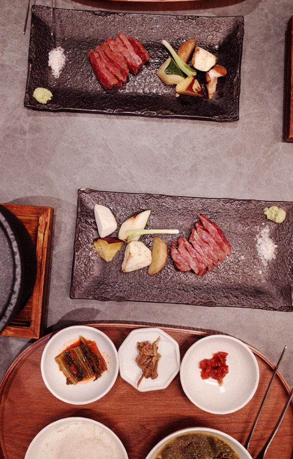 WOOHANA Jonggak · the signature Hanwoo showing — marbled beef cuts and caviar presented in a display chest