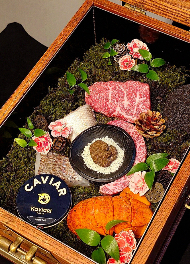 GOWOOGA Yeouido · the signature Hanwoo showing — marbled beef cuts and caviar presented in a display chest