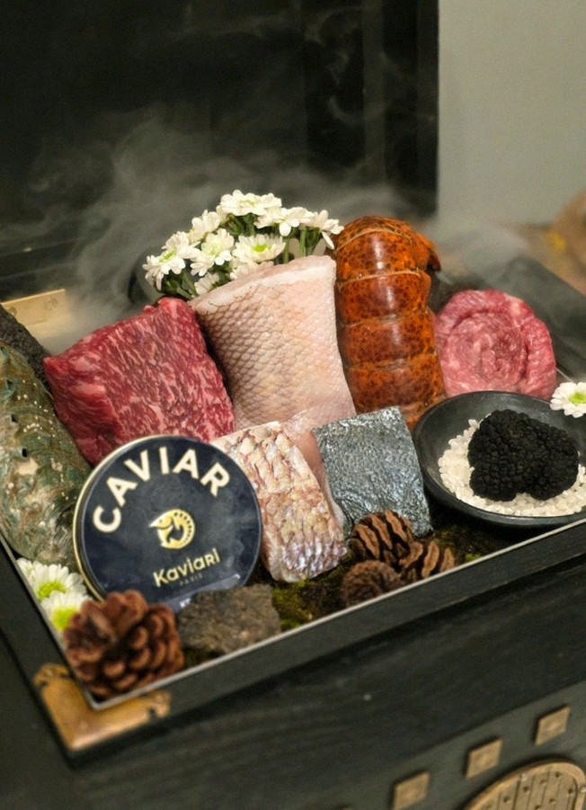 GOWOOGA Gwanghwamun · the signature Hanwoo showing — marbled beef cuts and caviar presented in a display chest