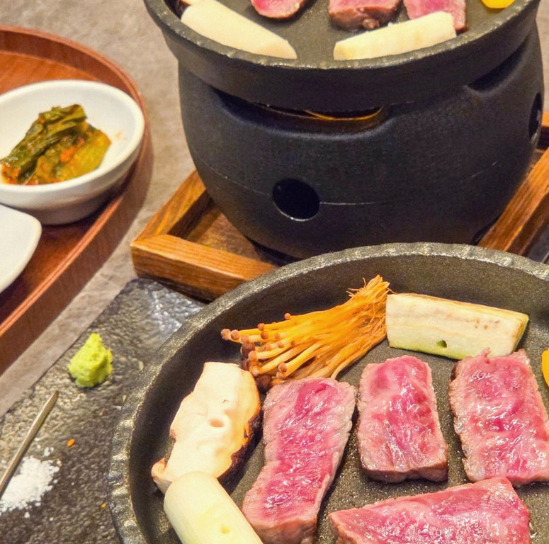 GOWOOGA Yeouido · the signature Hanwoo showing — marbled beef cuts and caviar presented in a display chest