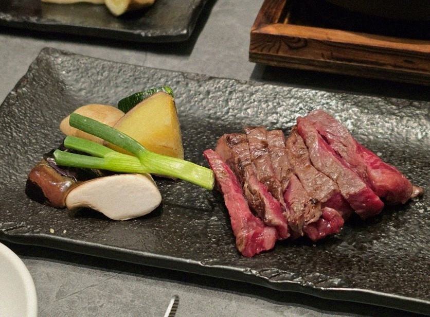 WOOHANA Jonggak · the signature Hanwoo showing — marbled beef cuts and caviar presented in a display chest