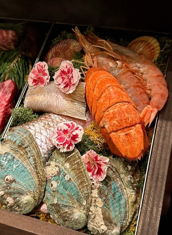 WOOHANA Jonggak · seafood course served alongside the beef