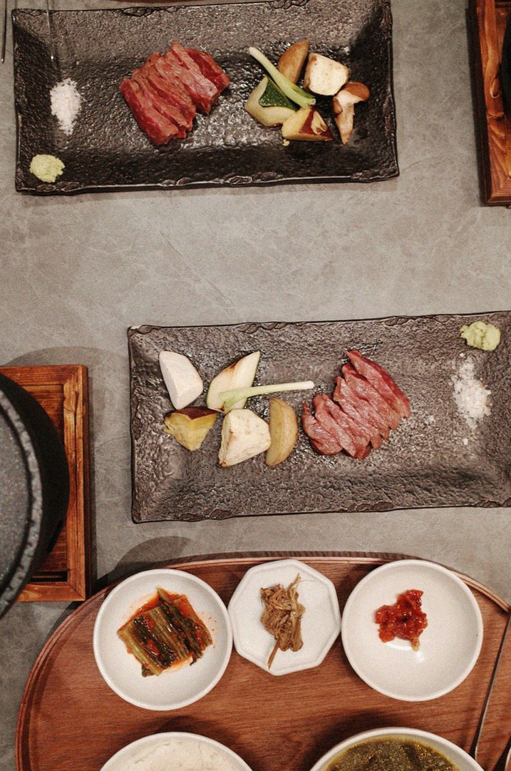 WOOHANA Jonggak · the signature Hanwoo showing — marbled beef cuts and caviar presented in a display chest