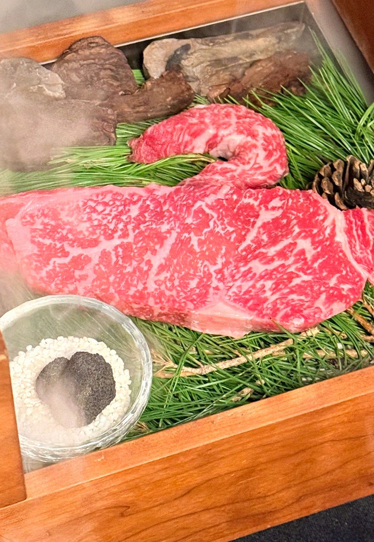 WOOARA Yeouido · the signature Hanwoo showing — marbled beef cuts and caviar presented in a display chest