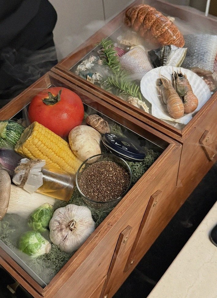 WOOARA Gwanghwamun · the signature Hanwoo showing — marbled beef cuts and caviar presented in a display chest