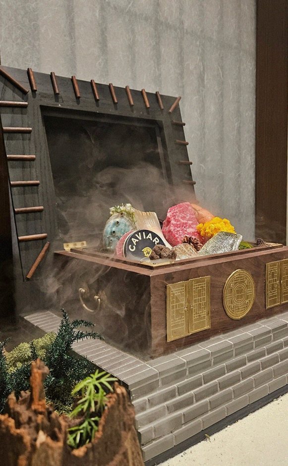 GOWOOGA Gangnam·Yeoksam · the signature Hanwoo showing — marbled beef cuts and caviar presented in a display chest