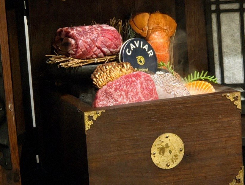DAEBOJUNG Yeouido · the signature Hanwoo showing — marbled beef cuts and caviar presented in a display chest
