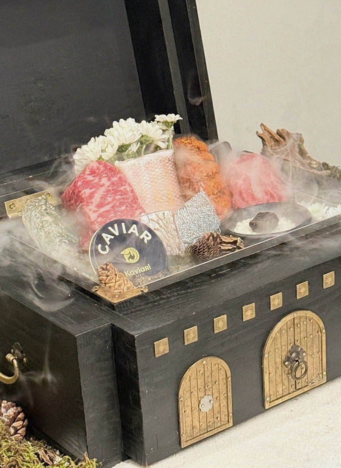 GOWOOGA Gwanghwamun · the signature Hanwoo showing — marbled beef cuts and caviar presented in a display chest