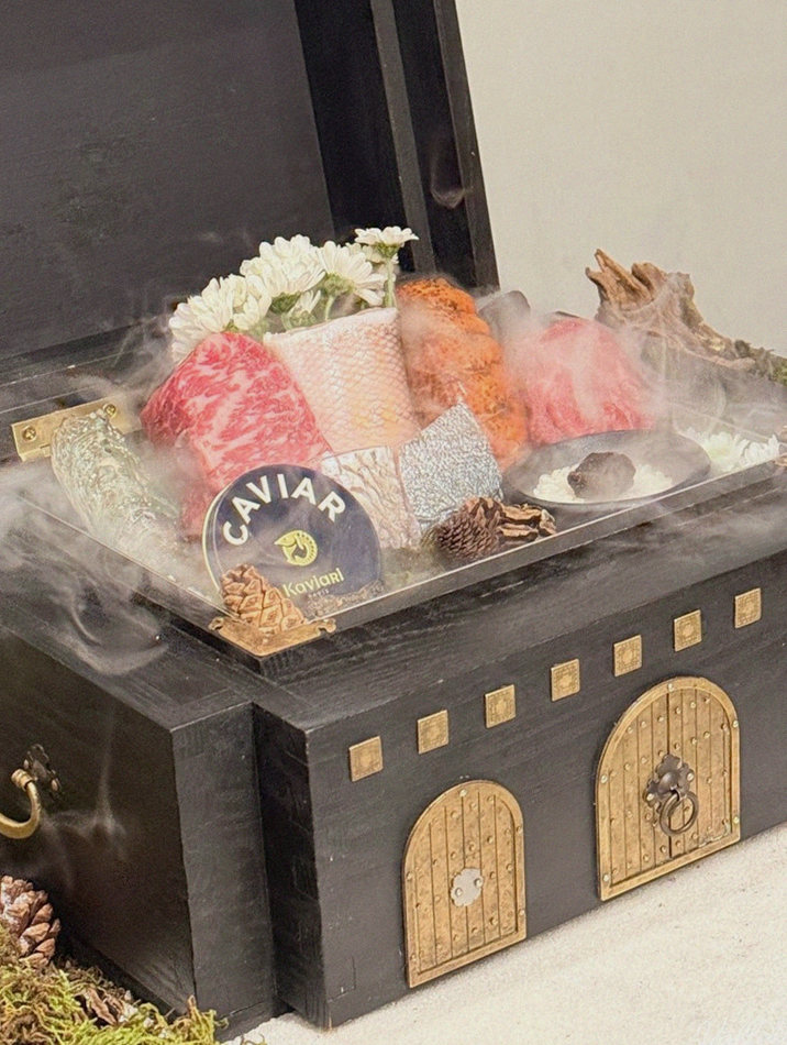GOWOOGA Yeouido · the signature Hanwoo showing — marbled beef cuts and caviar presented in a display chest