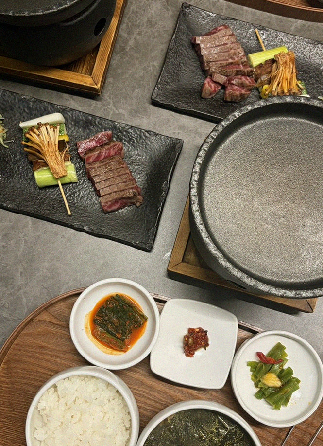 GOWOOGA Yeouido · the signature Hanwoo showing — marbled beef cuts and caviar presented in a display chest